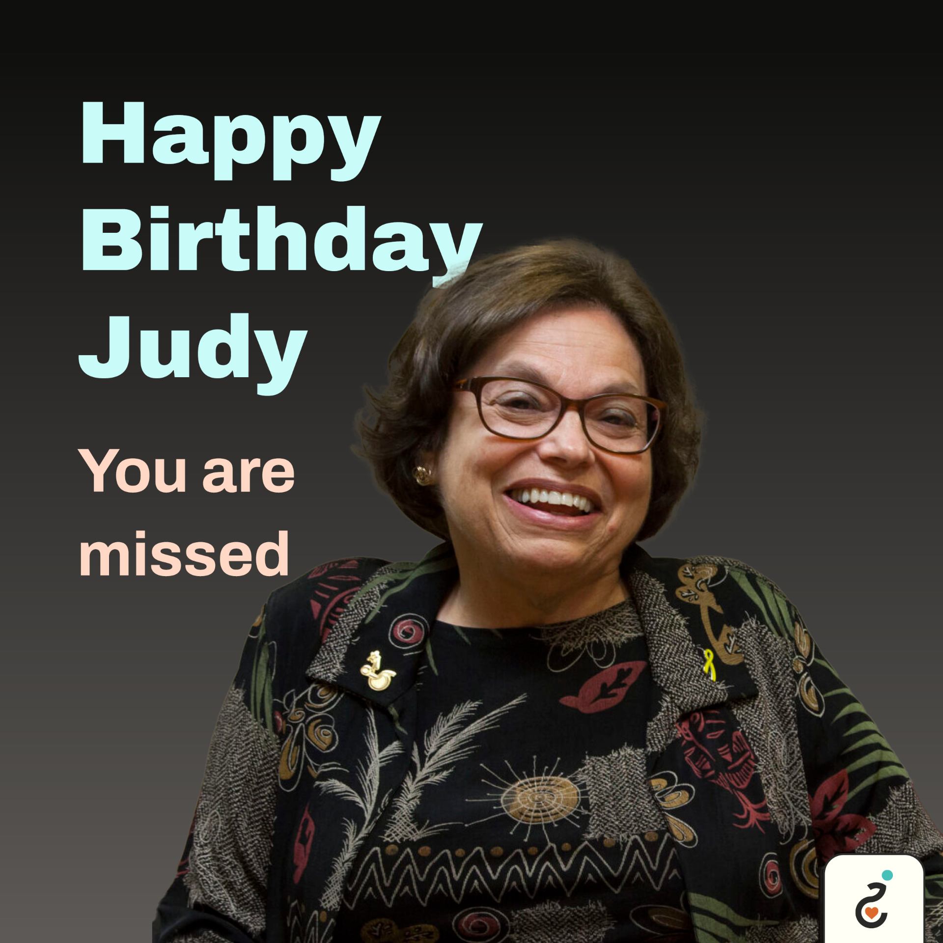A portrait of the late Judy Heumann and the words "Happy Birthday Judy, you are missed." Imposed behind her.