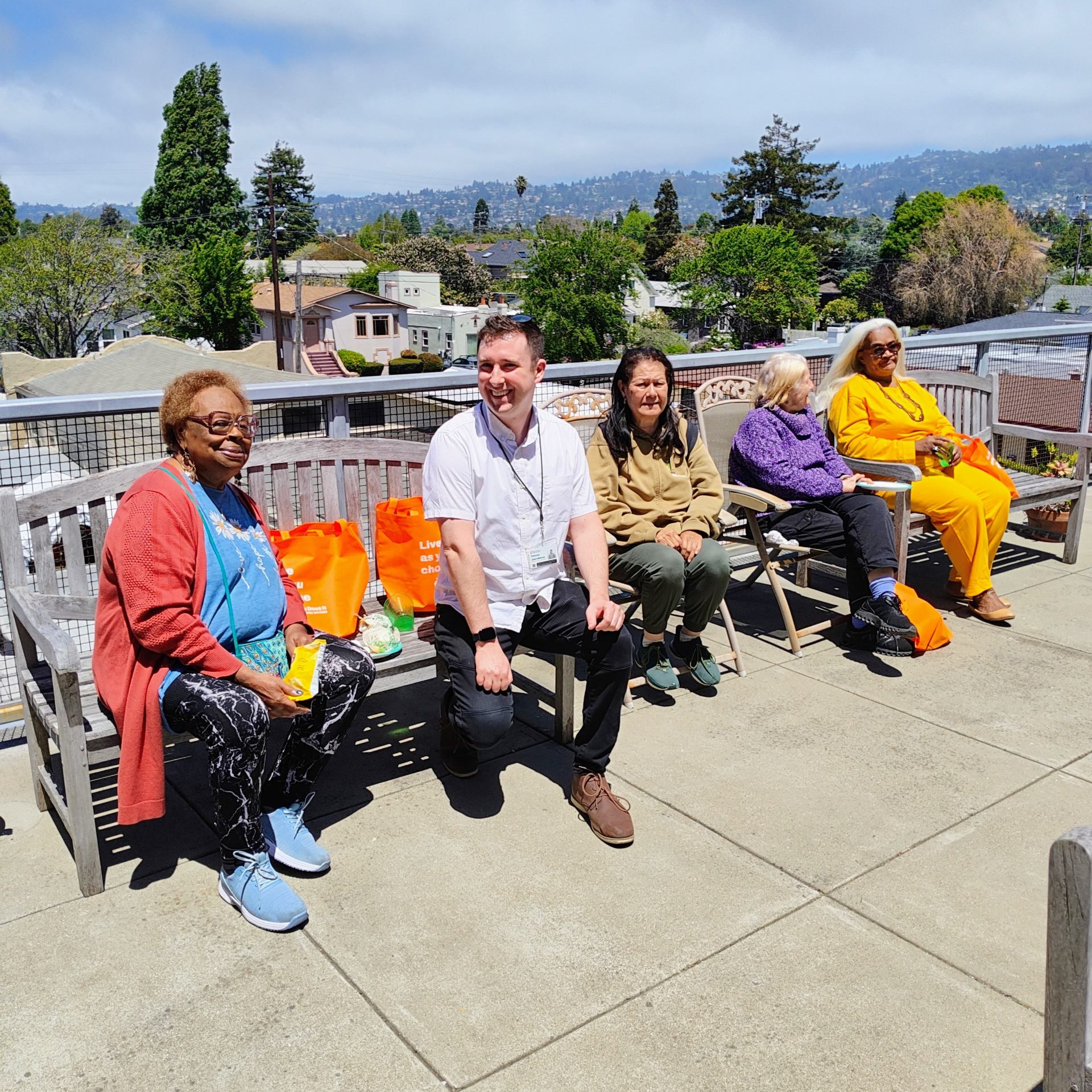 Trevor poses for a group photo with some of RCD Housings residents.